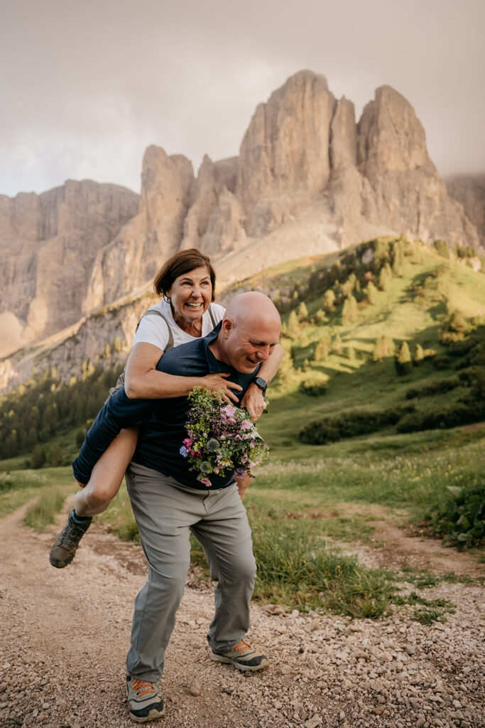 Happy couple hiking in scenic mountain landscape.