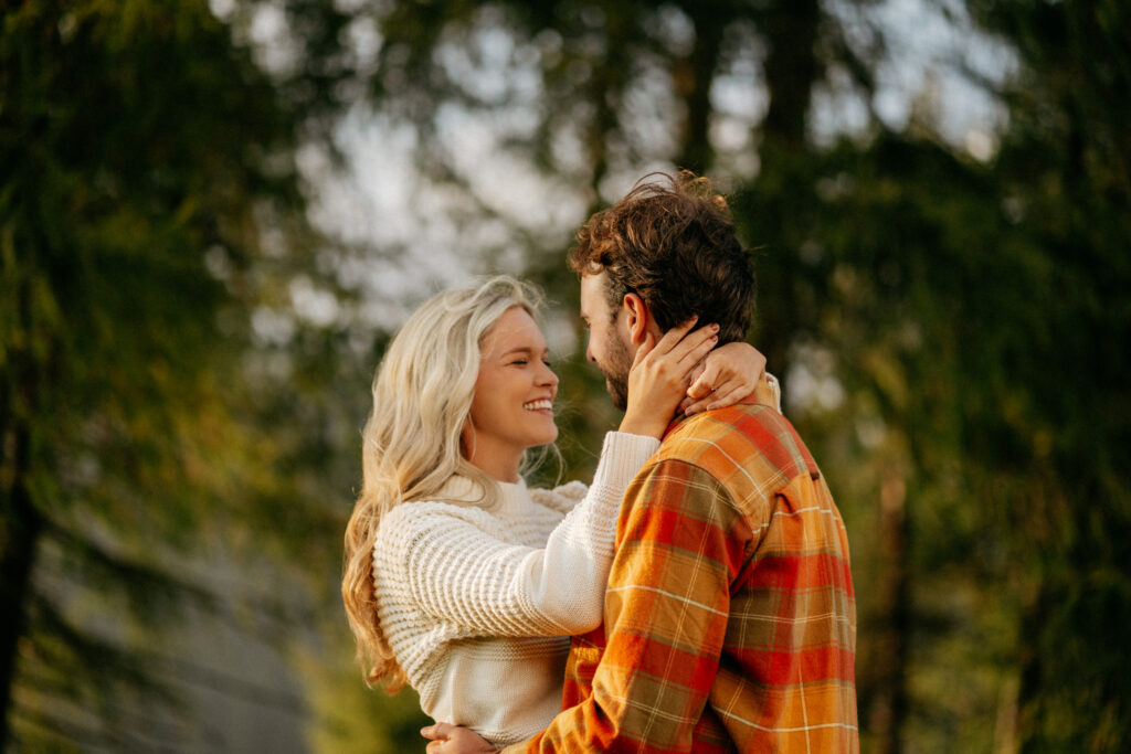 Couple embracing in a forest setting