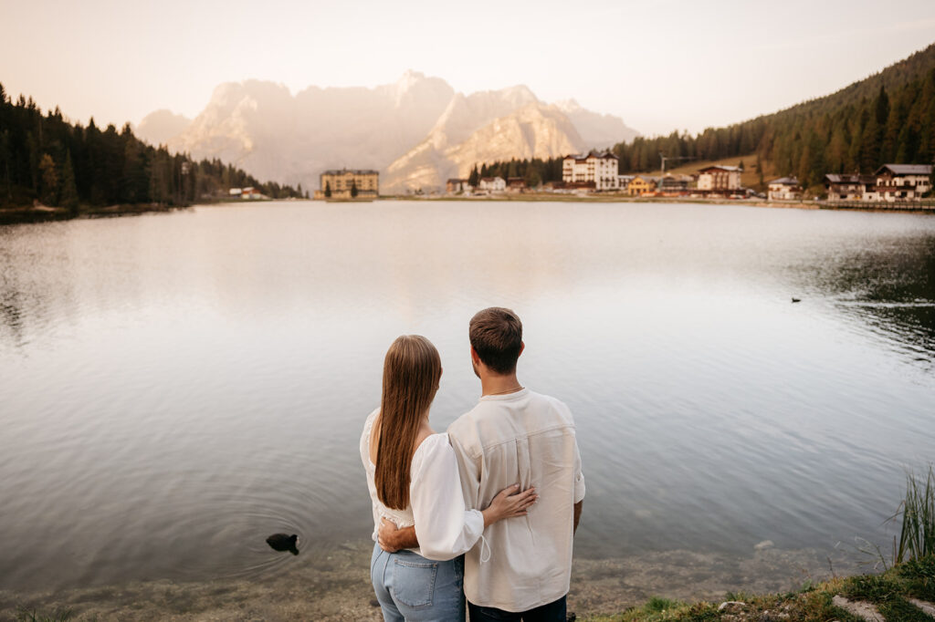 Couple enjoying lakeside mountain view