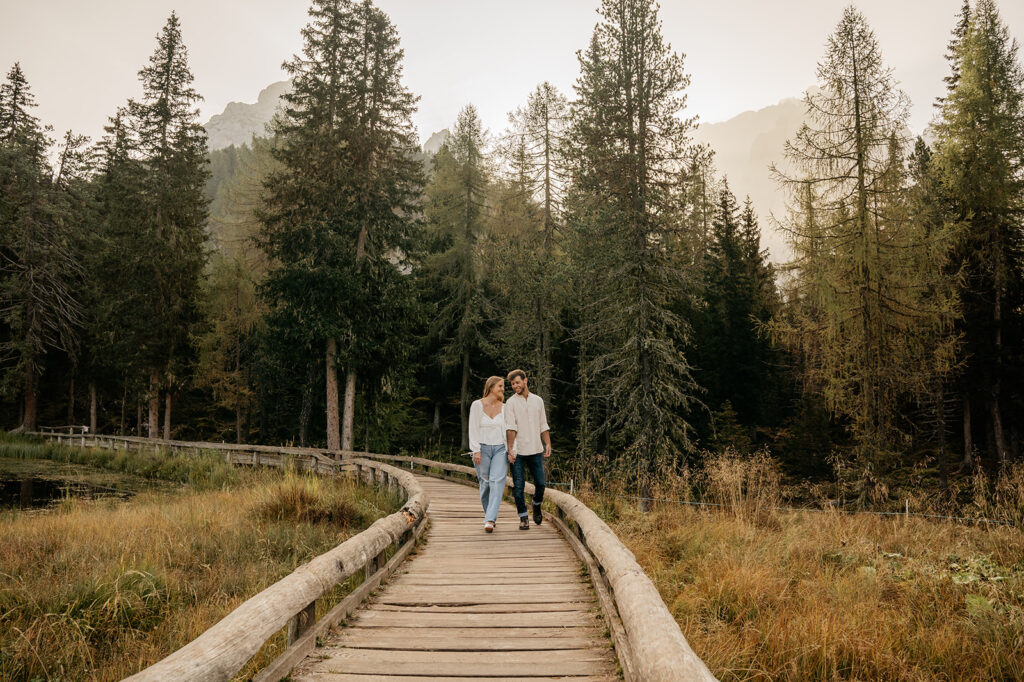 Couple walking on a forest boardwalk