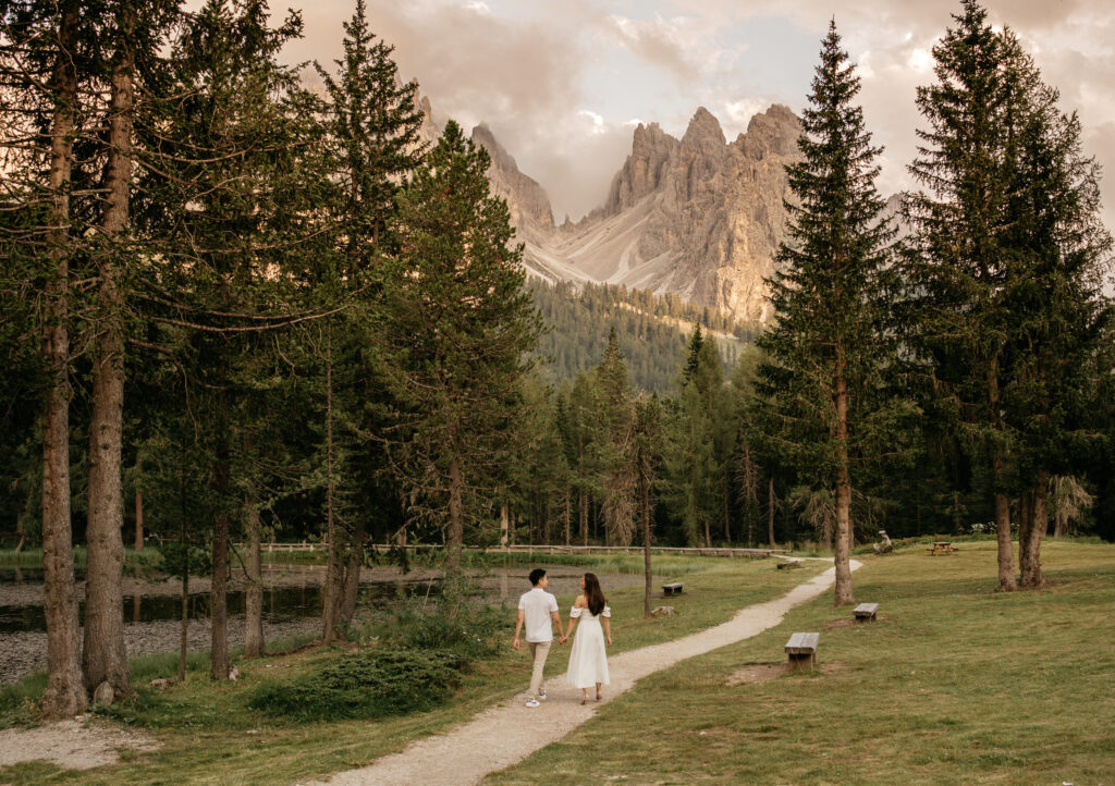 Couple walking in scenic mountain forest landscape