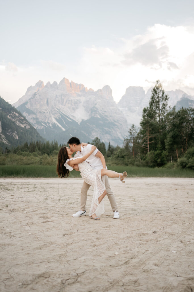 Couple dancing on sandy mountain landscape