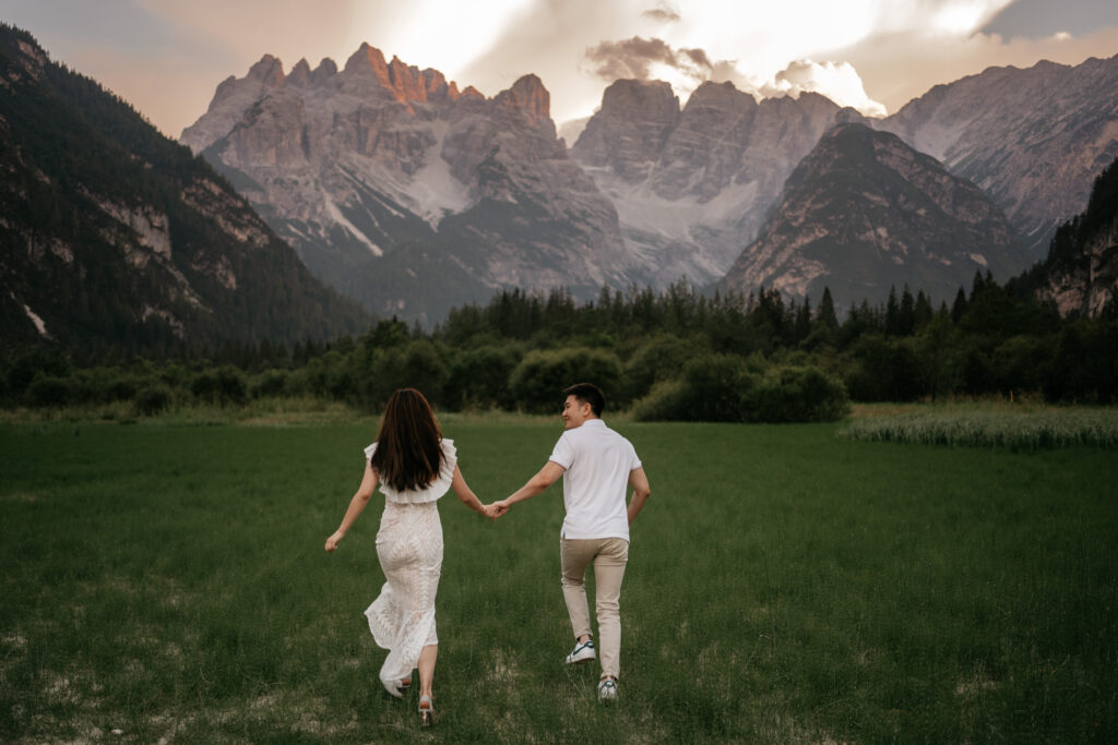 Couple holding hands in mountainous landscape