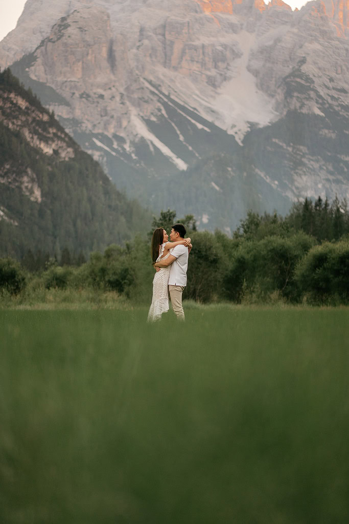 Couple embracing in scenic mountain landscape