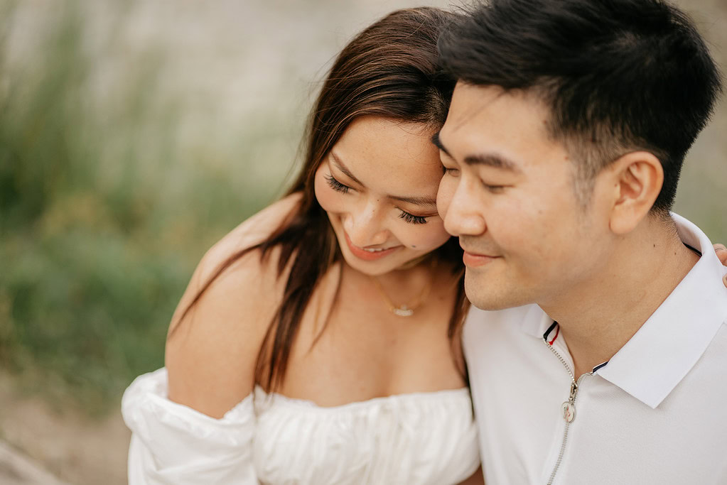 Smiling couple embracing outdoors