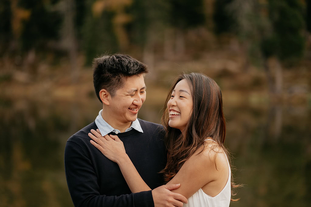 Smiling couple embracing outdoors