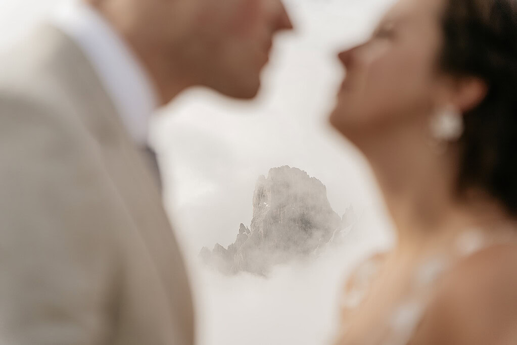 Blurred couple with misty mountain background