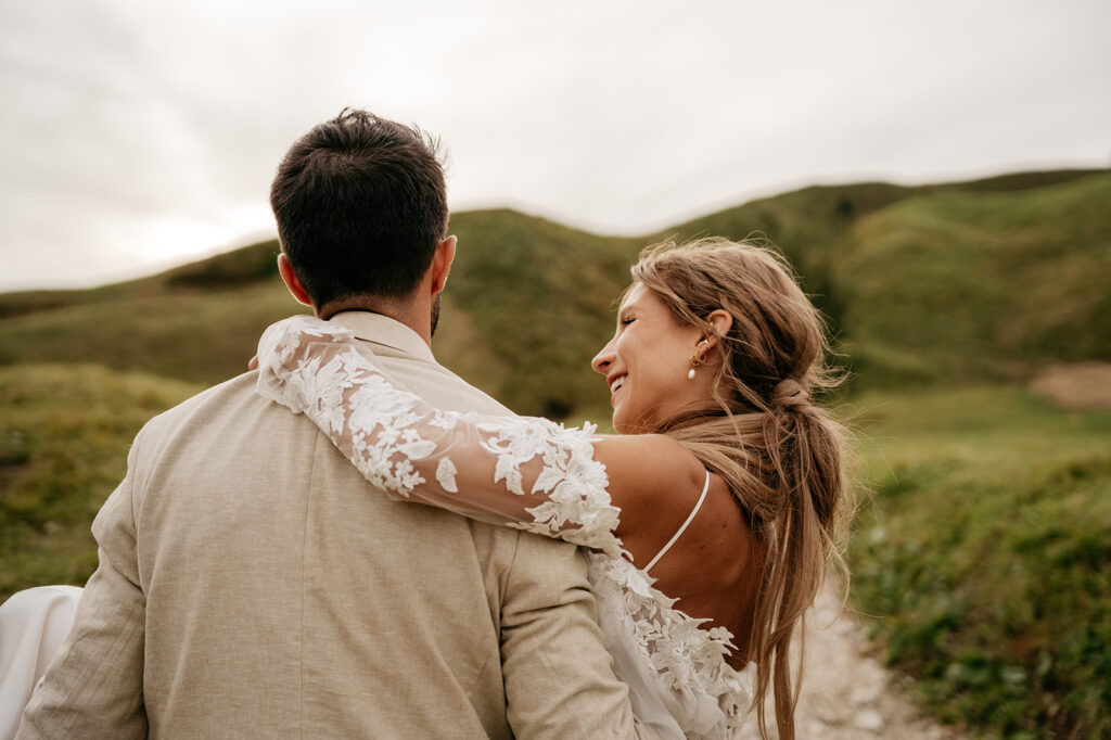 Couple embracing in scenic outdoor setting.