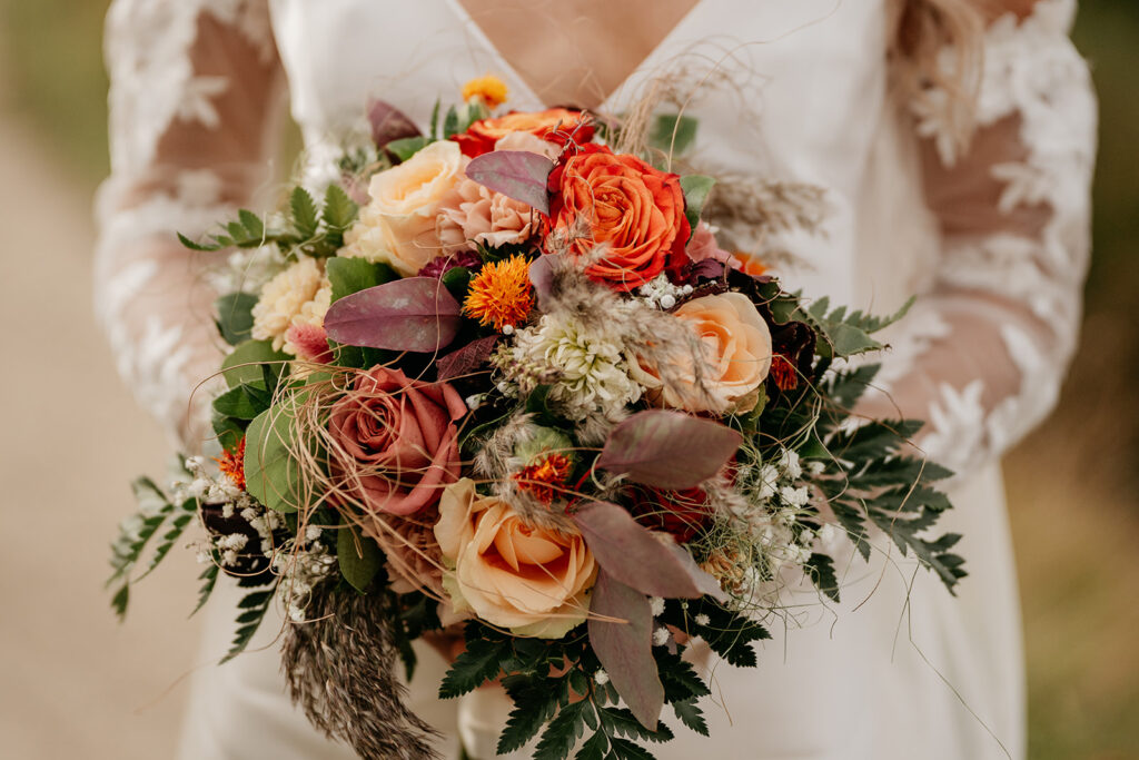 Bride holding colorful floral bouquet