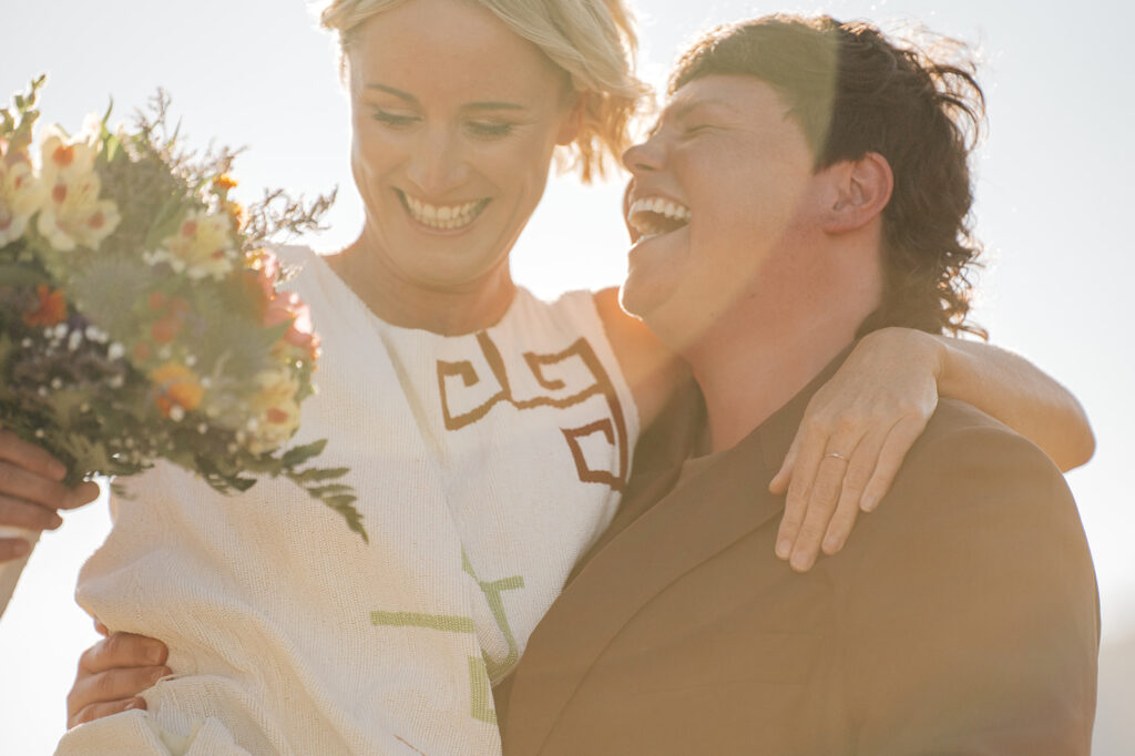 Happy couple embracing with flowers