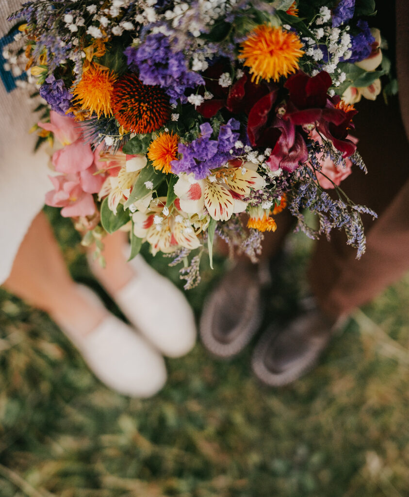 Close-up of colorful bridal bouquet on grass