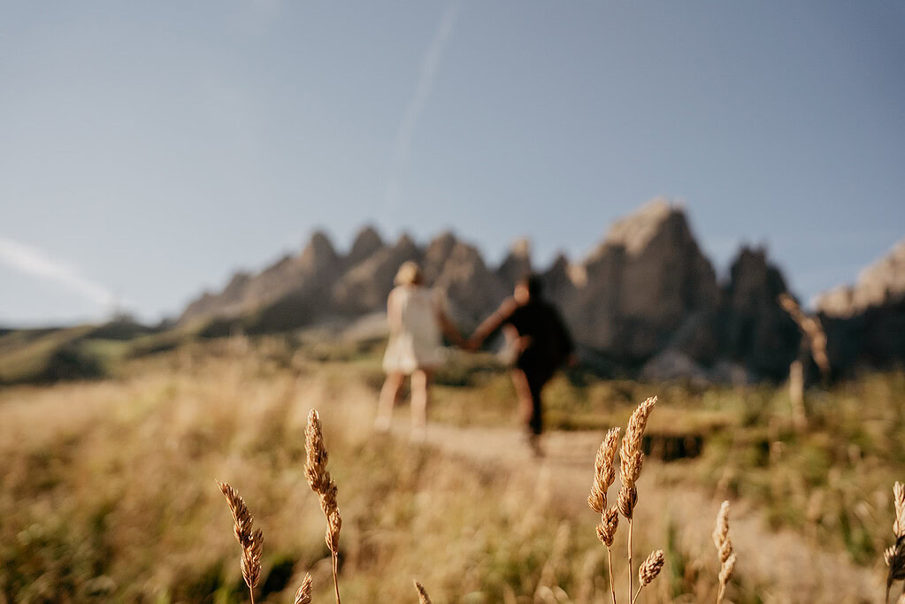 Couple hiking in scenic mountain landscape