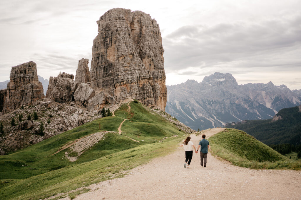 Couple hiking in Dolomite mountains scenery