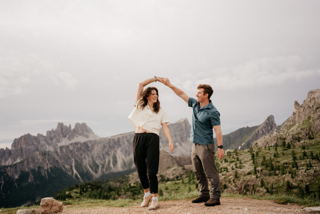 Couple dancing on a mountain trail