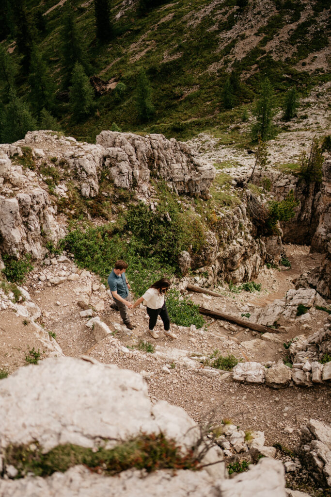 Couple hiking on rocky mountain trail