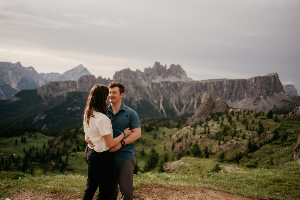 Couple embracing in scenic mountain landscape