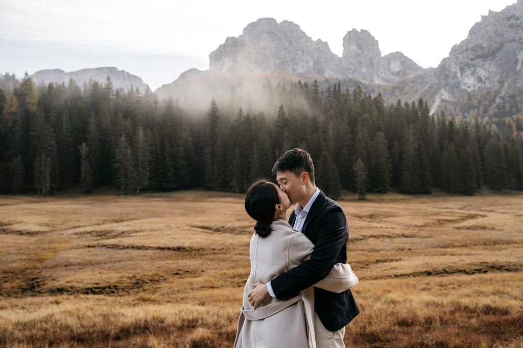 Couple kissing in scenic mountain landscape