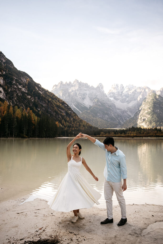 Couple dancing by mountain lake