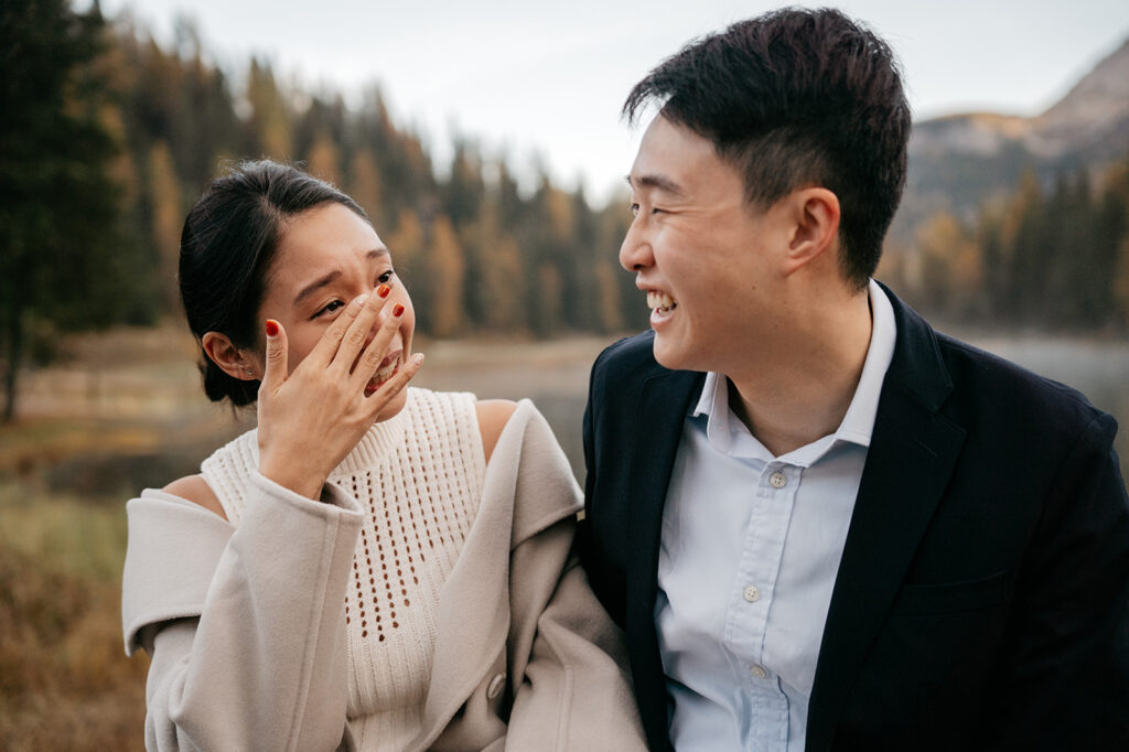 Couple laughing and enjoying nature together.