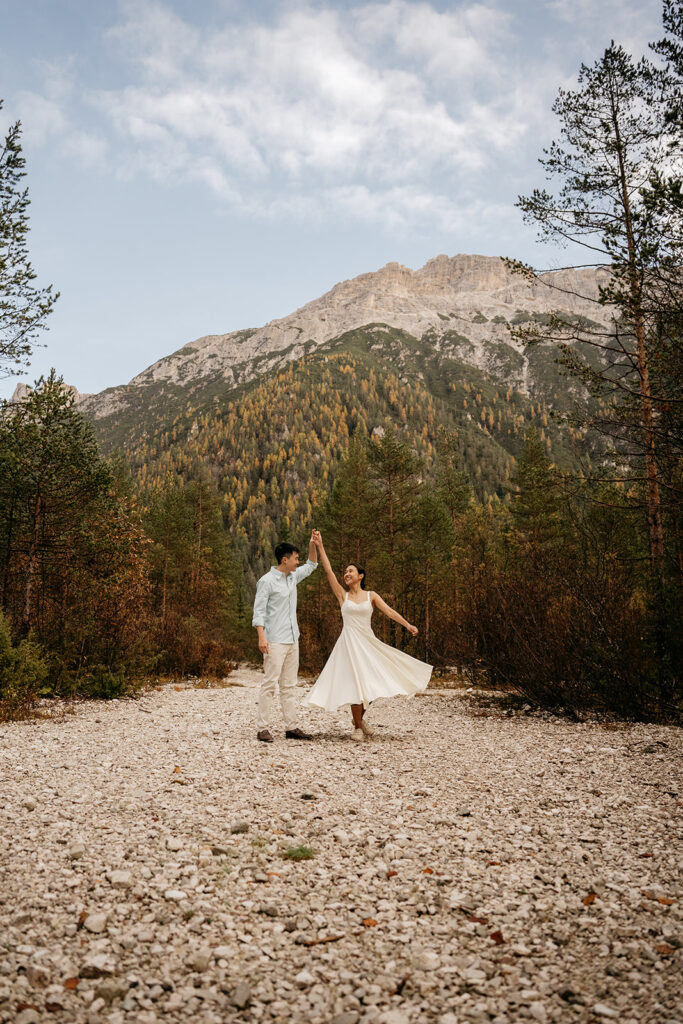 Couple dancing in mountain landscape