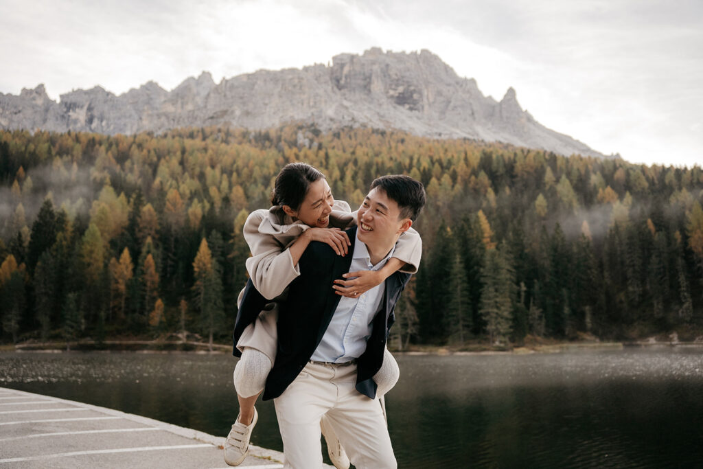 Couple enjoying nature with mountain background.