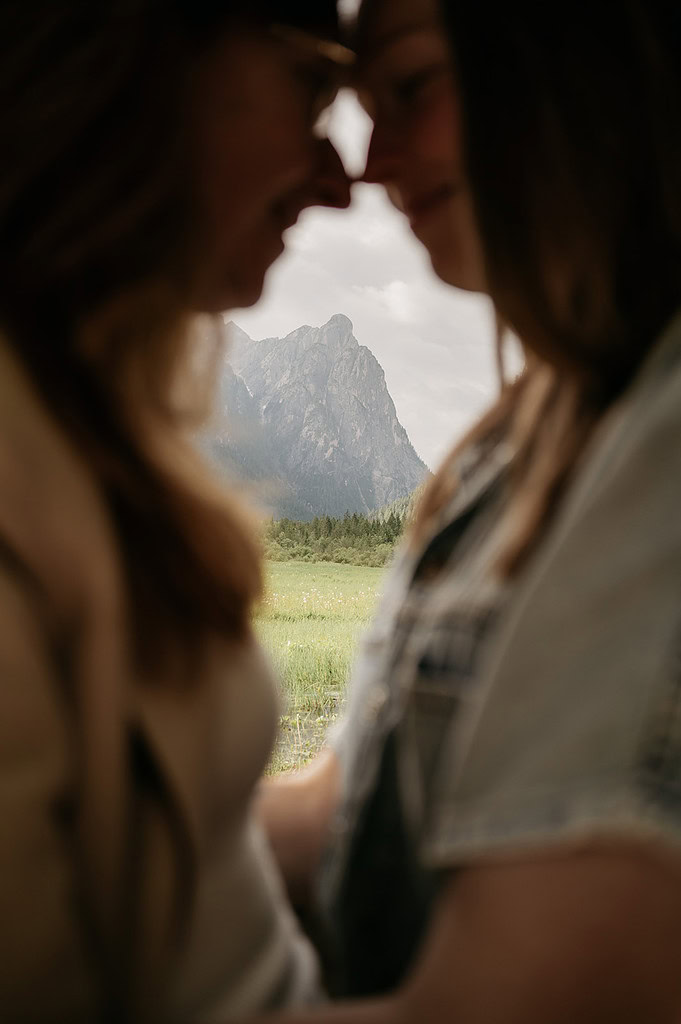 Silhouettes with mountain landscape background.