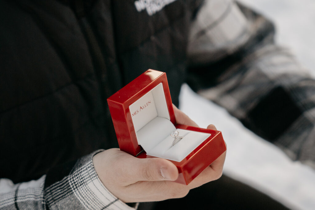 Red ring box with diamond engagement ring