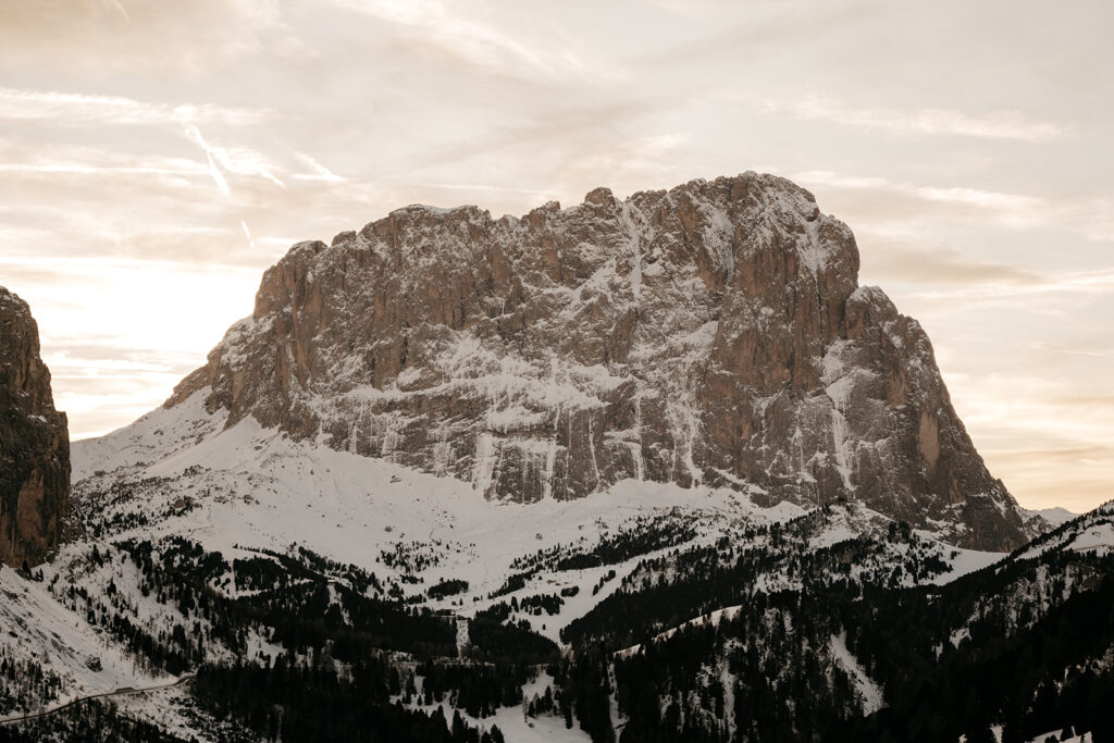 Snowy mountain landscape at sunset.