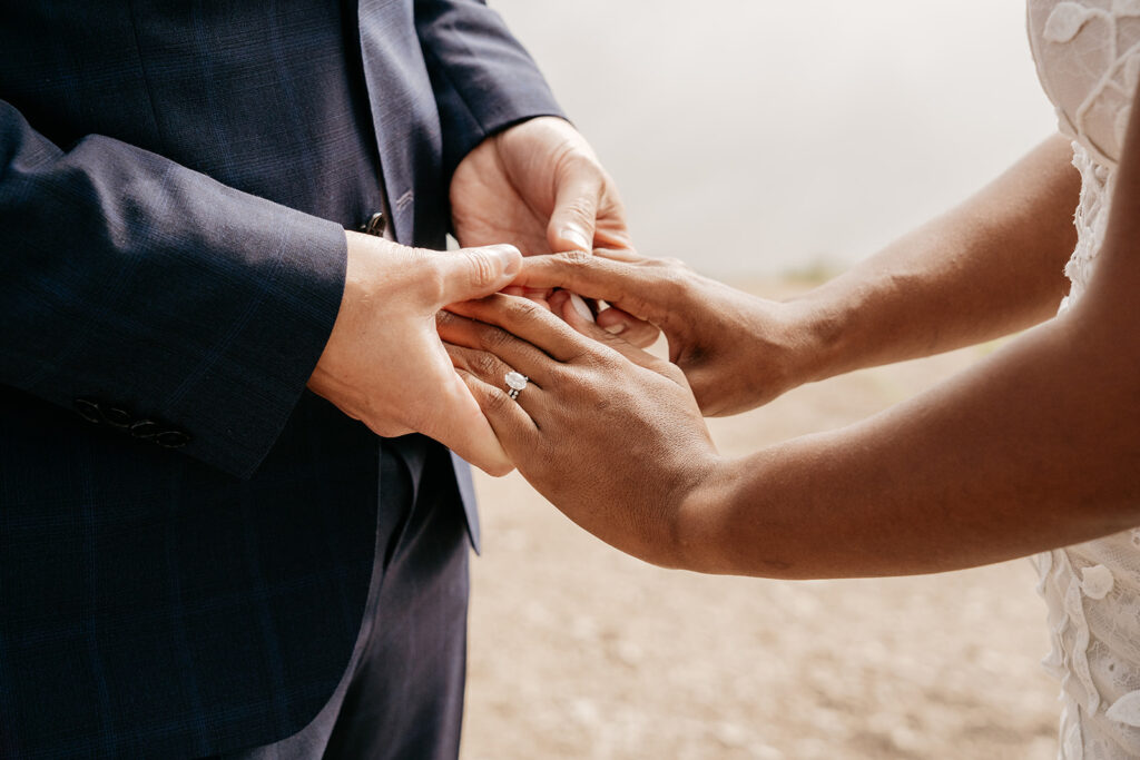 Couple exchanging rings during wedding ceremony