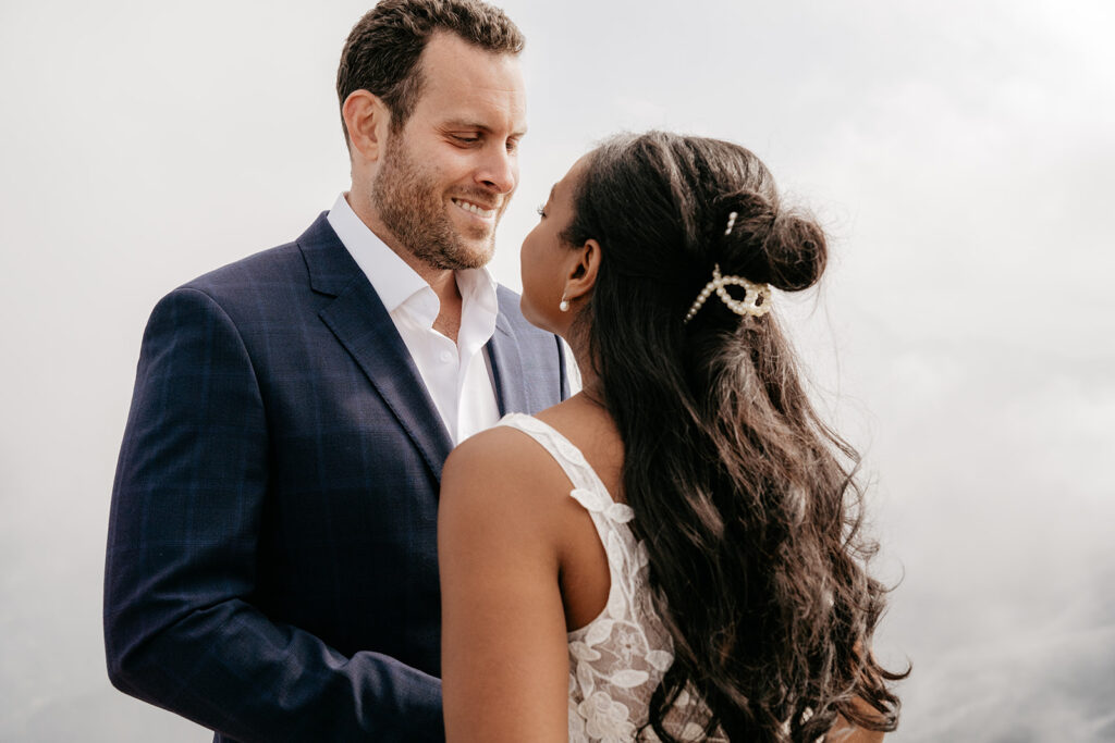 Couple gazing at each other on wedding day.