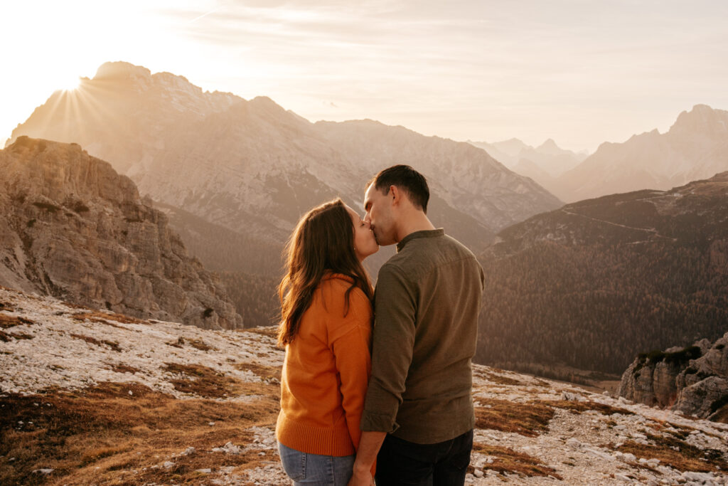 Couple kissing in scenic mountain landscape