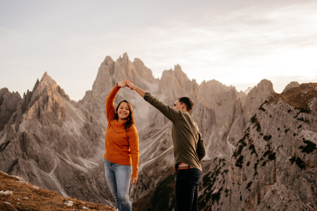 Couple dancing in scenic mountain landscape