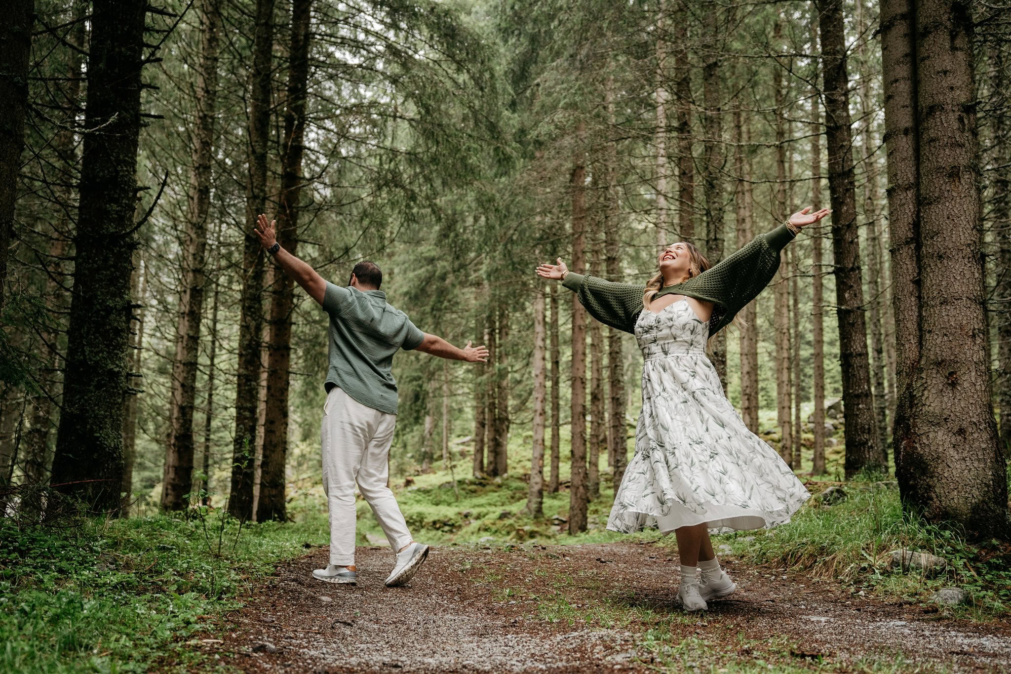 Happy couple dancing in a forest