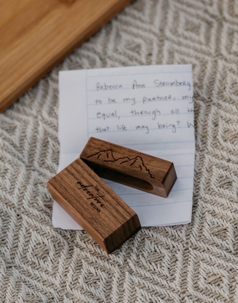 Wooden box on handwritten note on woven fabric.