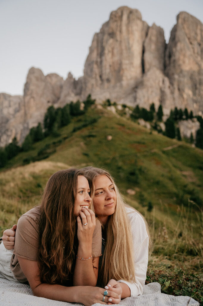 Two people relaxing in mountain landscape.