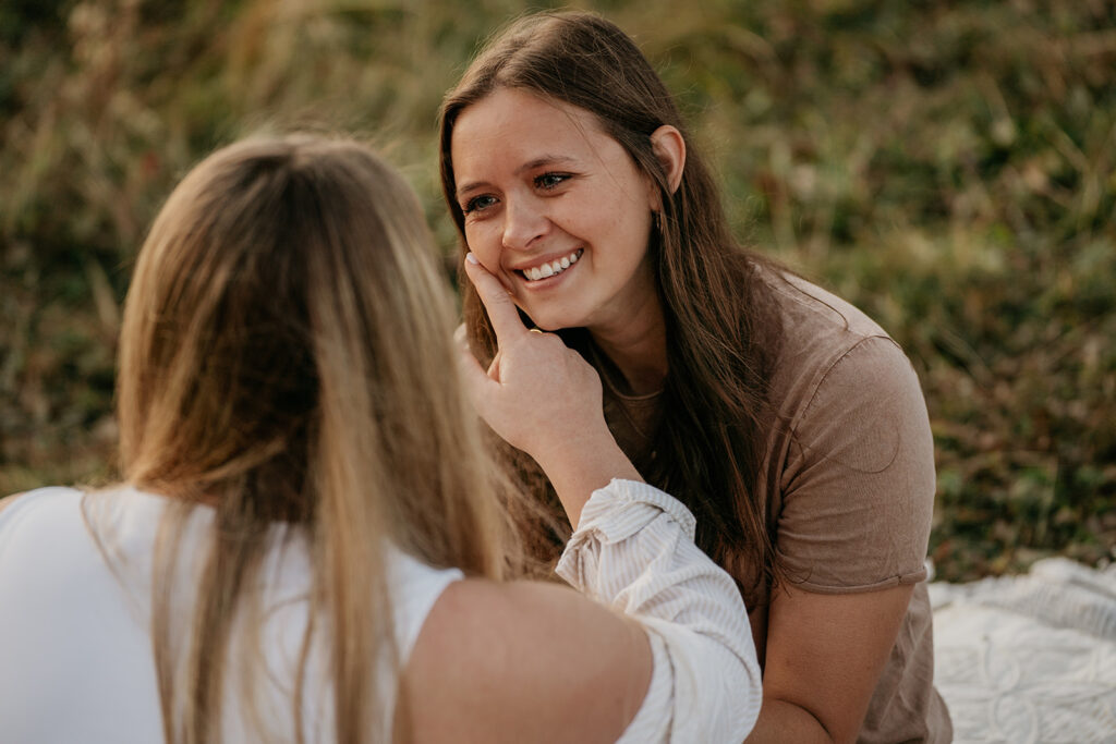 Two women enjoying a happy moment outside together.