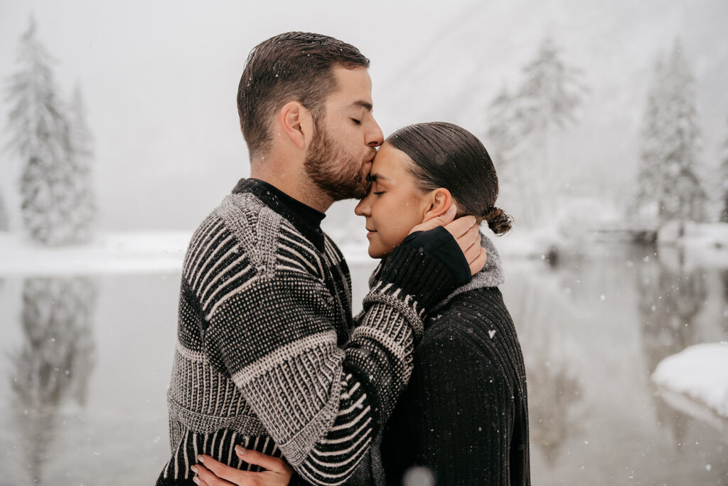 Couple embracing in snowy landscape