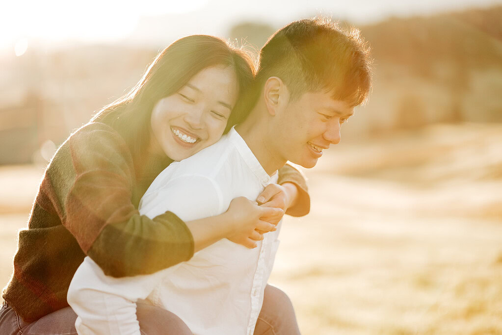 Smiling couple enjoying a sunny day together.