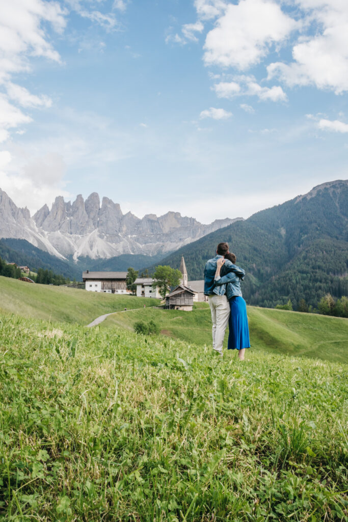 Couple embraces in scenic mountain landscape