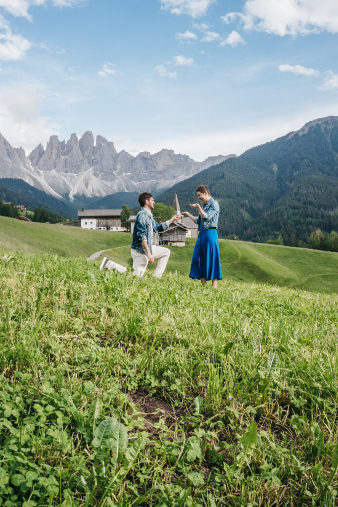 Marriage proposal on scenic mountain landscape