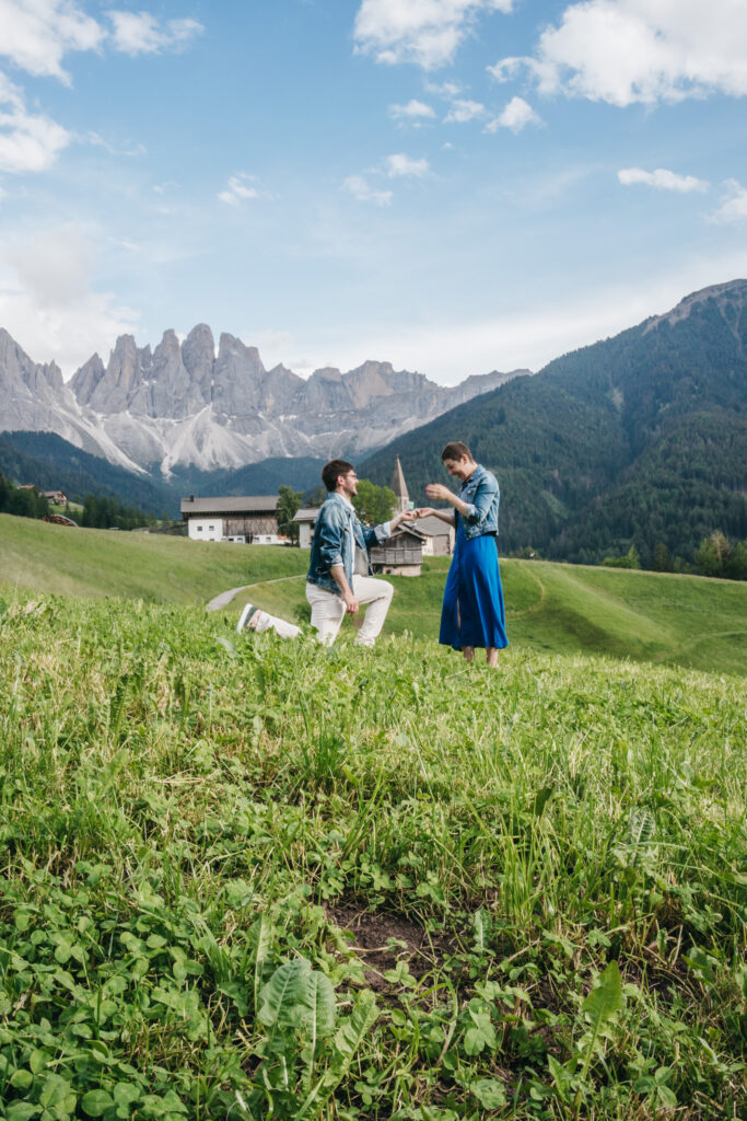 Marriage proposal in scenic mountain landscape