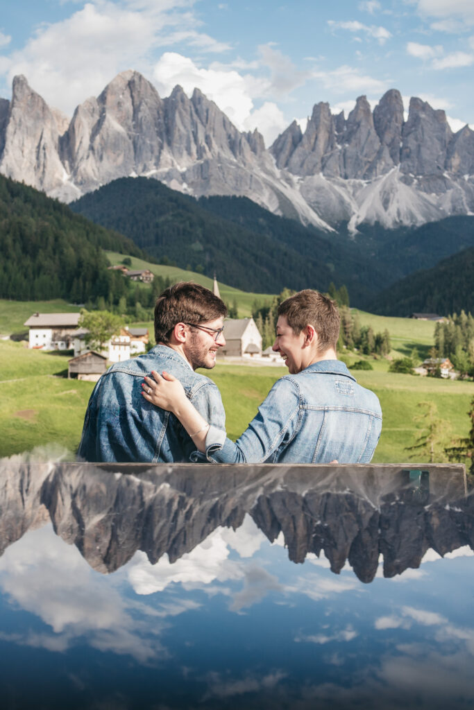 Couple smiling in scenic mountain landscape