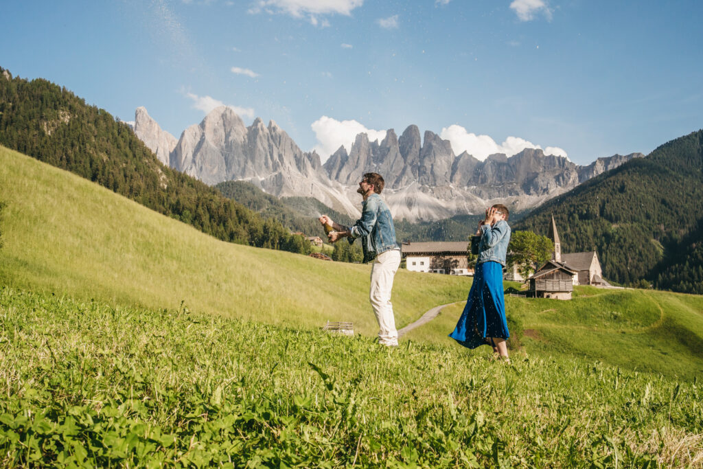 Couple celebrating in scenic mountain landscape