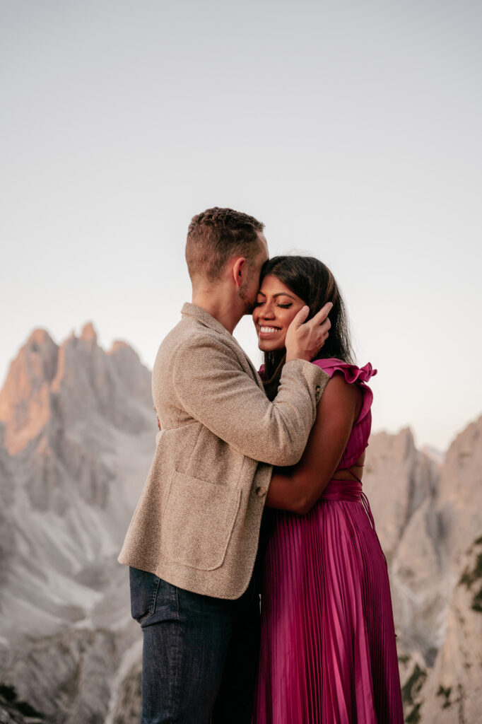 Couple embracing with mountain backdrop