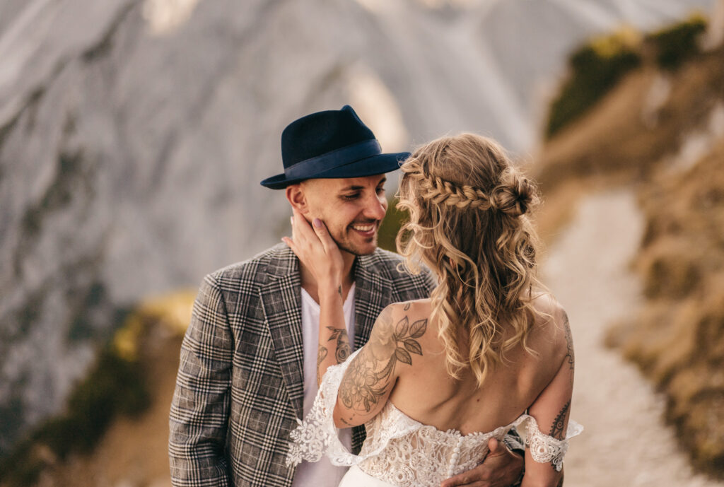 Couple embracing on mountain path