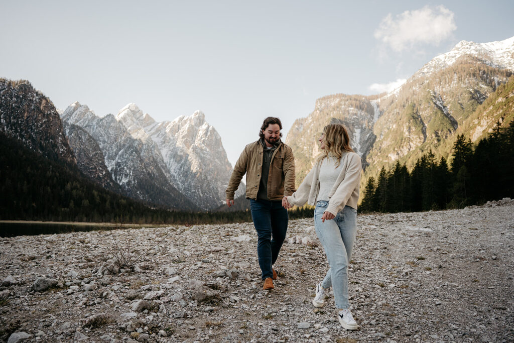 Couple walking on rocky mountain path