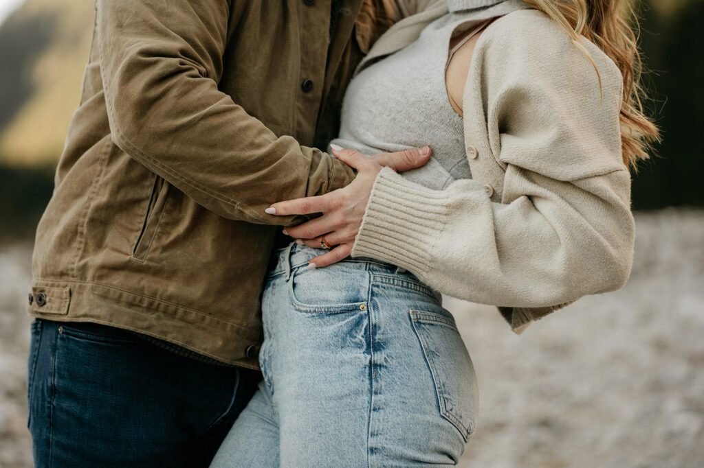 Couple embracing outdoors in casual clothes