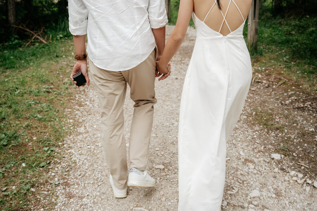 Couple walking hand in hand on path