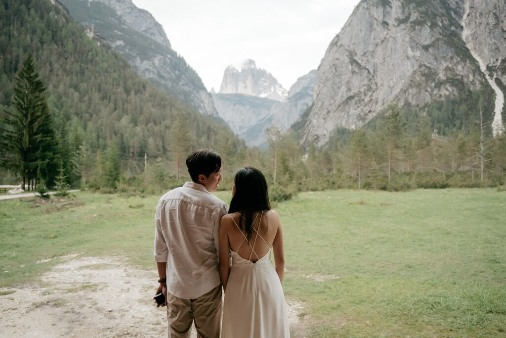 Couple gazing at mountain landscape view