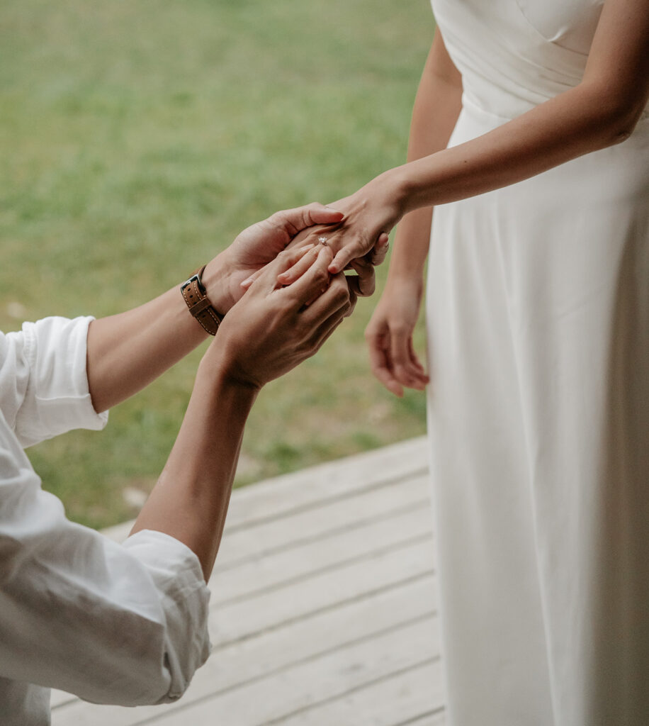 Man proposing with ring outdoors.